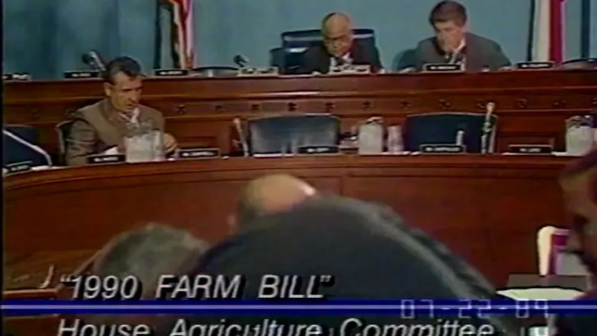 Hearing of the U.S. House Agriculture Committee during discussion of the 1990 Farm Bill, with lawmakers seated at a dais in a congressional chamber.