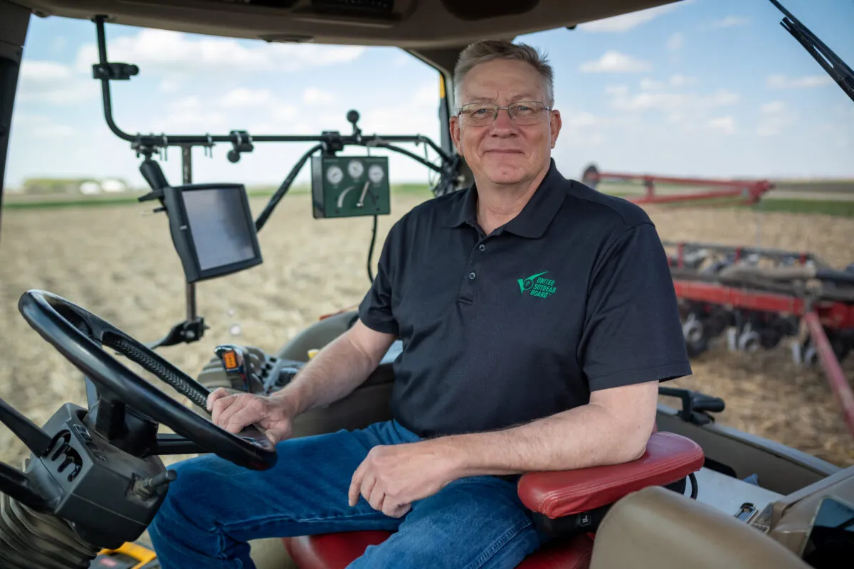 Man sitting inside a tractor.