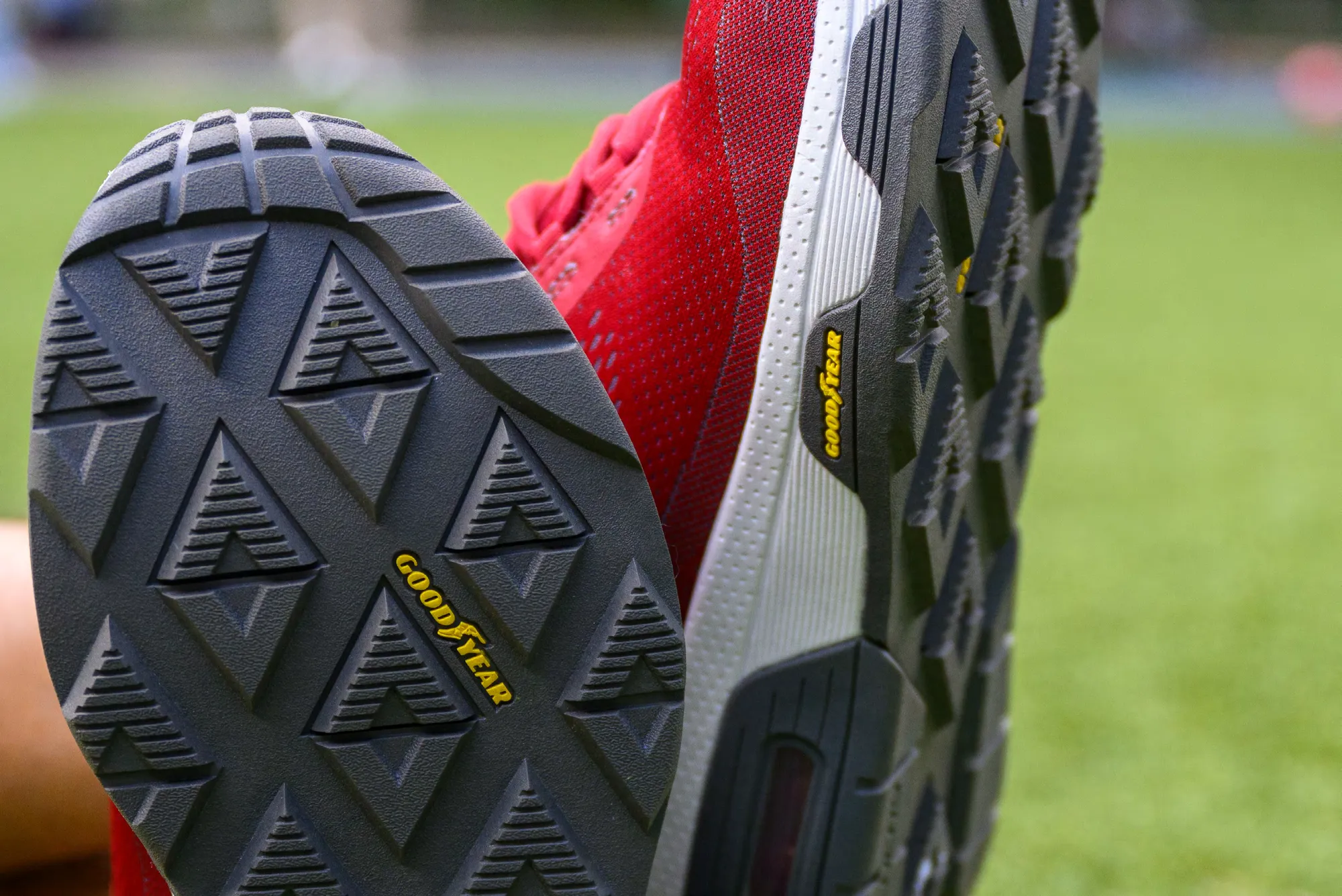 Close-up of the tread pattern on a red Skechers athletic shoe, with Goodyear rubber technology branding visible on the outsole.