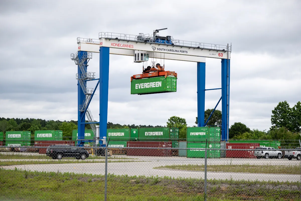 A crane lifts an Evergreen shipping container at the South Carolina Inland Port at Dillon.