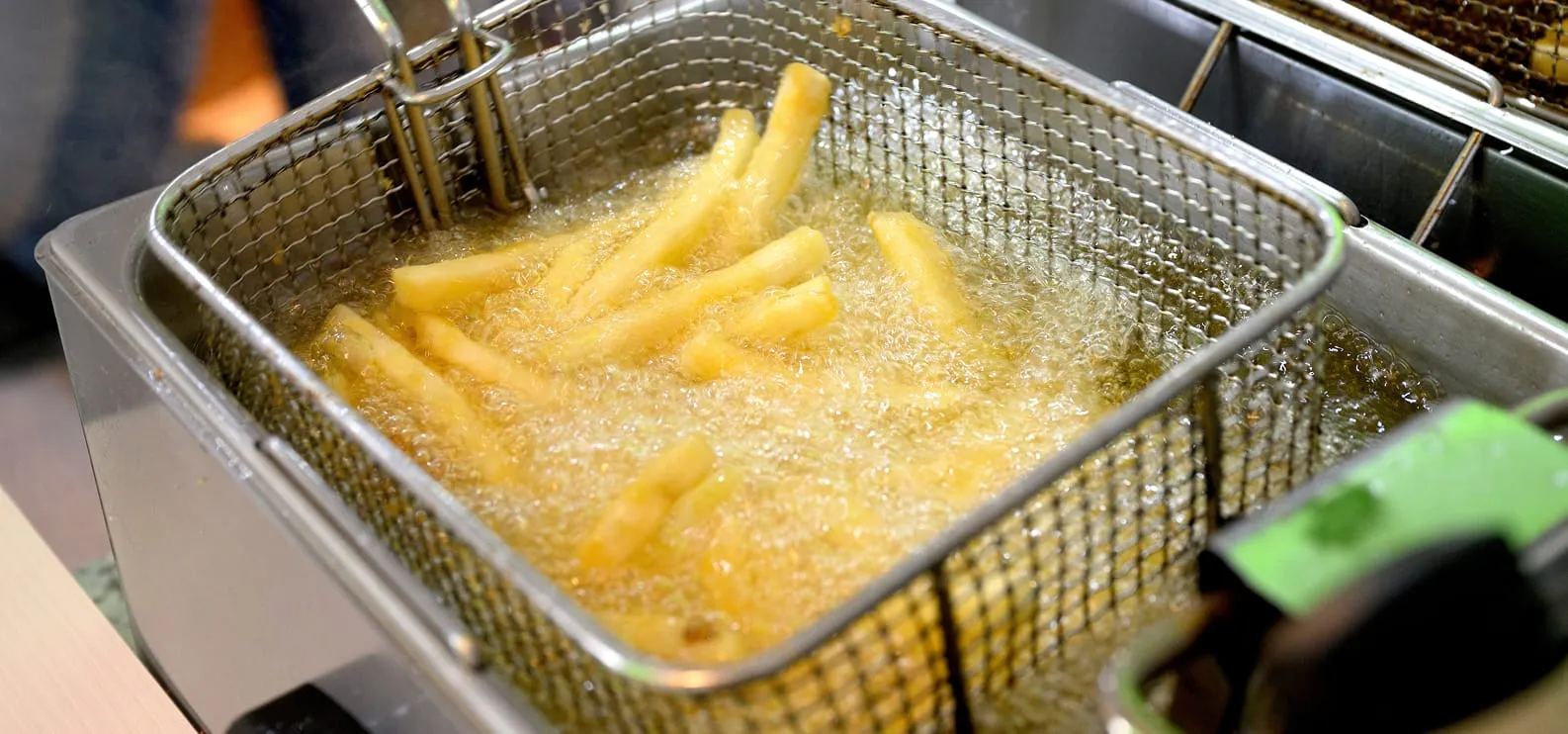 French fries frying in soybean oil