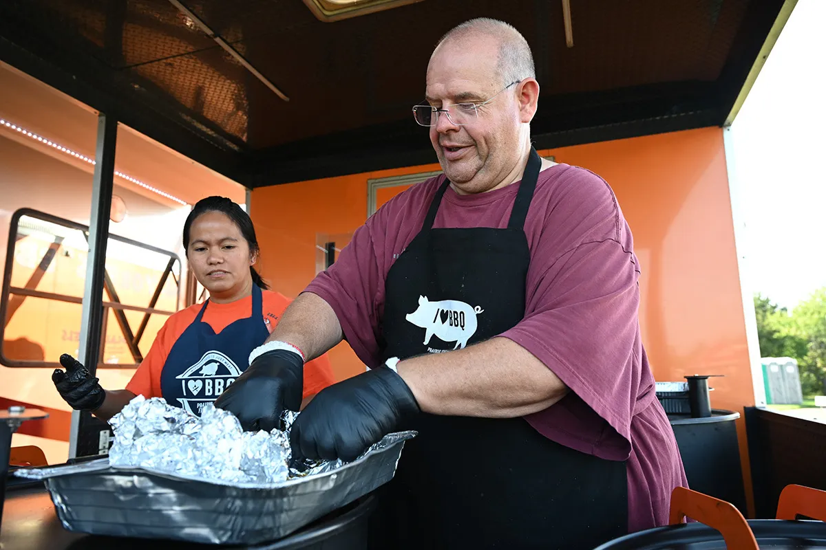 Cooks prepare barbecue at a KCBS Master Series Tour event featuring U.S. Soy.