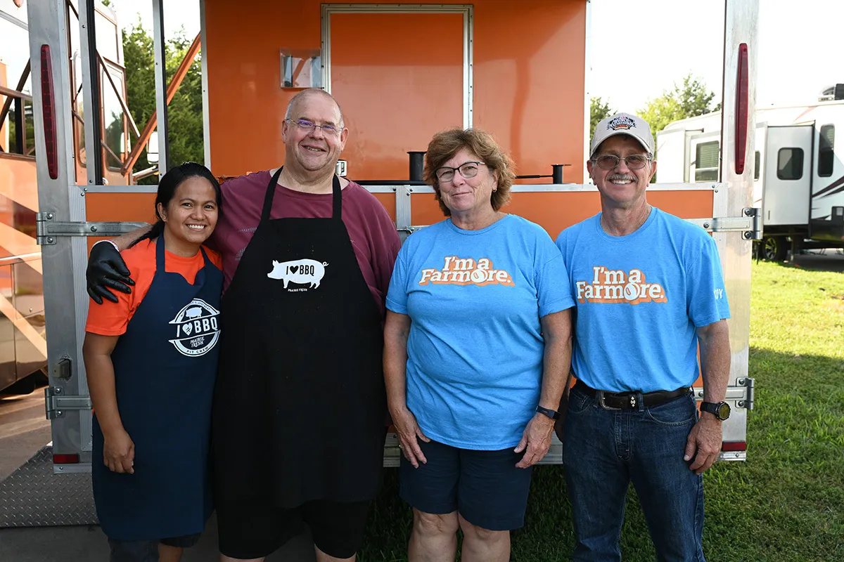Farmers and barbecue team members pose together at a KCBS Master Series Tour event.