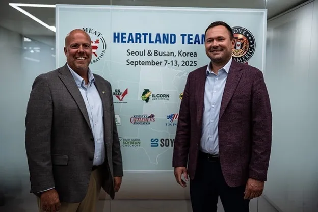 Brent Gatton and Matt Gast stand together in South Korea during a Heartland Team tour.