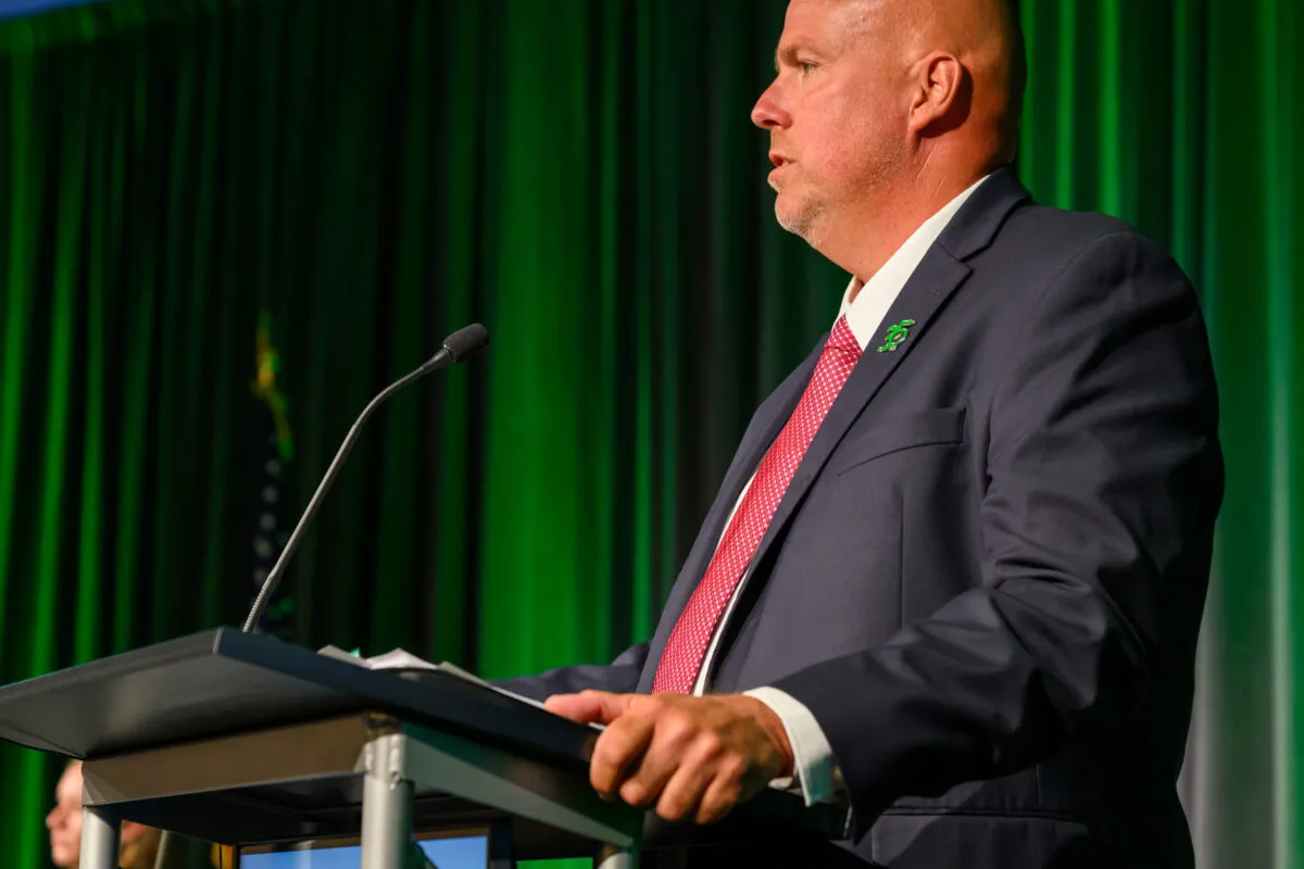 A man stands at a podium.