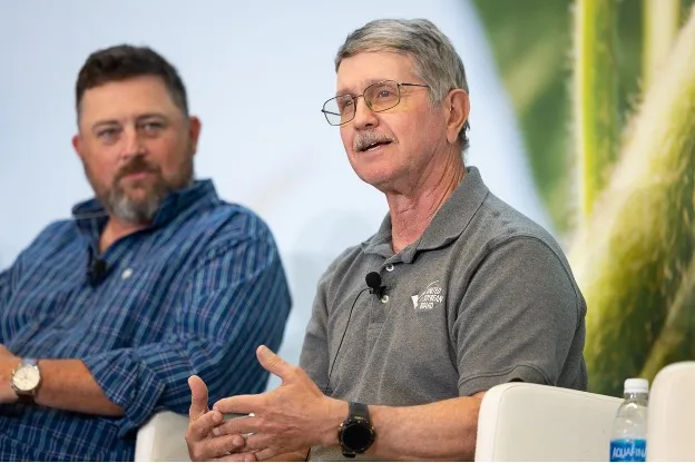 Brent Rendel speaks during a panel discussion on U.S. soybean farming and industry topics.