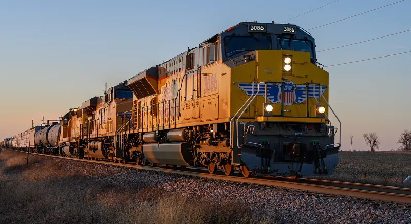 Freight train on railway tracks representing soy biodiesel adoption across Class 1 railroads.