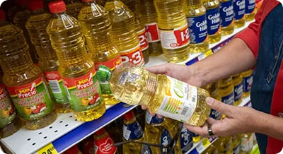 Grocery store shelf featuring soybean oil and soy-based food products.